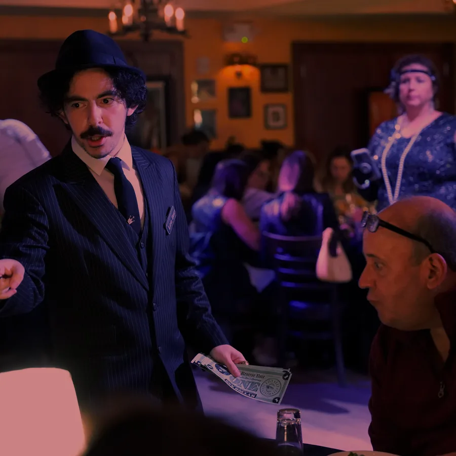 A Murder Mystery Company actor working the room at a New Jersey show