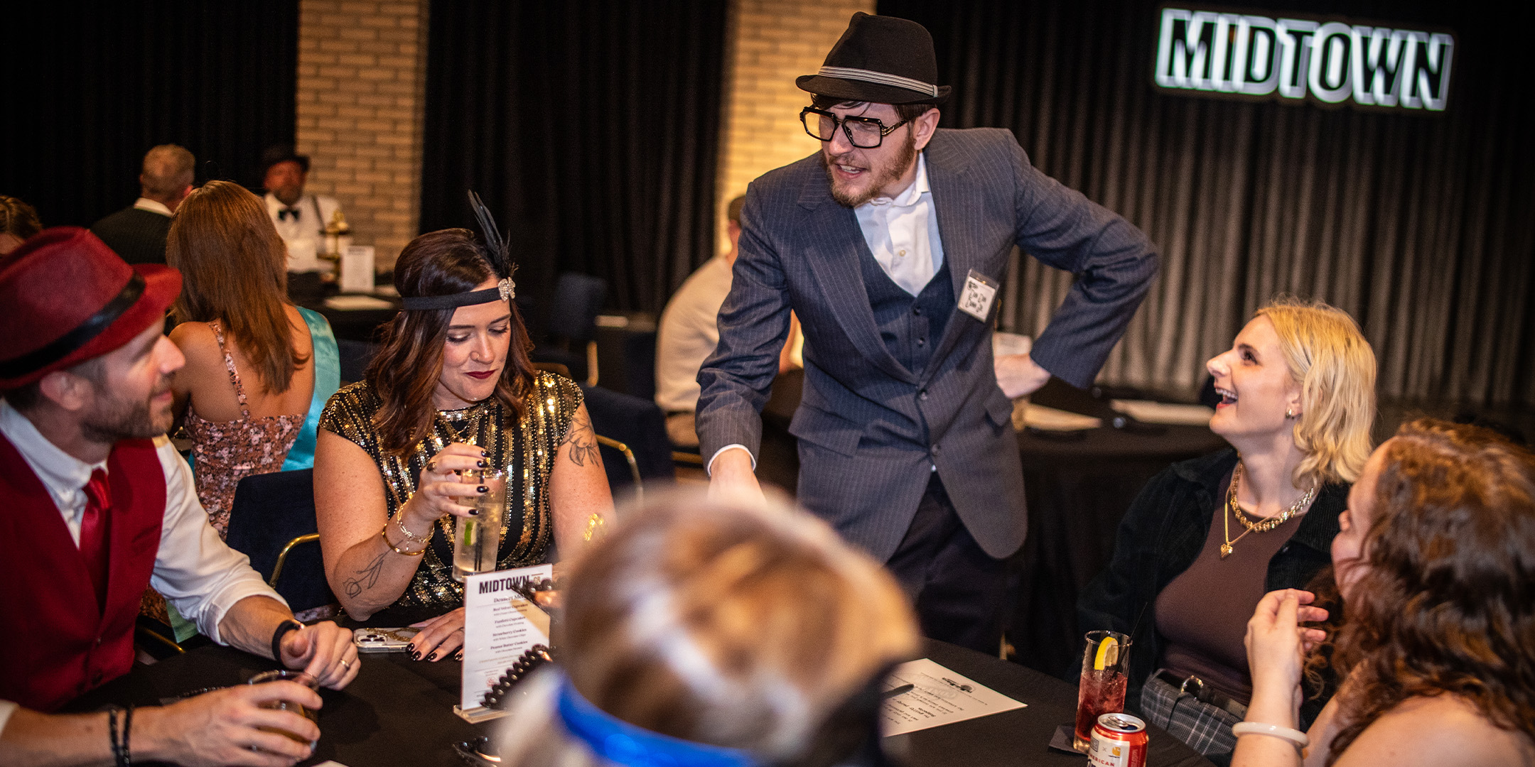 Guests at a Murder Mystery Company public dinner show in New Jersey